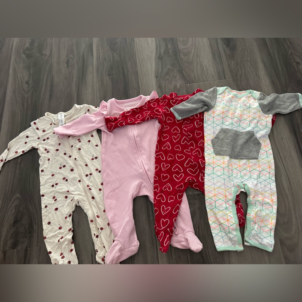 Set of Four Baby Onesies with Heart Patterns